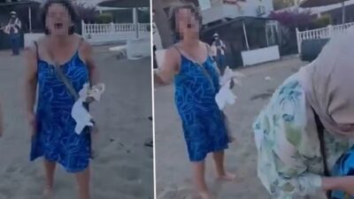 İzmir'in Seferihisar ilçesinde, sitesinin önündeki plajda bir anne ile kızına